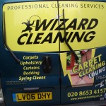 Back of A Blue Wizard Cleaning Van